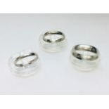 Three platinum wedding rings, total weight 16.2 grams.