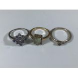 A 9ct white gold spinel and diamond daisy style cluster ring, set with 9 x round cut spinels and 4 x
