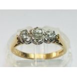 An 18ct yellow gold diamond ring, set with three round brilliant cut diamonds in a claw setting,