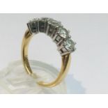 An 18ct yellow gold diamond ring set with five round brilliant cut diamonds in a claw setting, total
