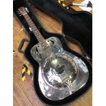 A Vintage steel body acoustic resonator guitar, with rosewood fretboard, in fitted and lined hard