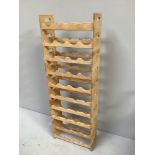 A set of ten wooden stackable wine shelves, holds 40 bottles