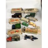 A collection of seven assorted boxed clockwork, tinplate Tri-Ang Minic scale model vehicles