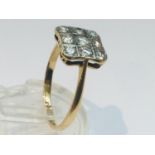 An 18ct gold and platinum diamond ring, set with 9 x round brilliant cut diamonds in a Deco style,