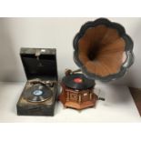 An 'His Master's Voice' gramophone in octagonal wooden housing with vertical column dividers, wood