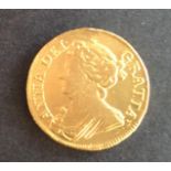 Queen Anne 1711 gold Guinea sometime cleaned/polished and used as a jewellery item judging by the