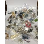 A large selection of assorted costume jewellery including a vintage large blue stone necklace, a