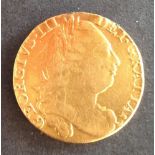 A gold George III Guinea dated 1776 ' sometime cleaned/polished but still strong legend and