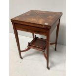 An Edwardian inlaid rosewood envelope card table, the top decorated with urns and scrolled