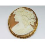 An 18ct gold large oval cameo of grecian lady with grape vines in her hair, measures 22 x 18mm,