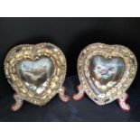 A pair of Victorian freestanding Sailors Valentines, decorated with shells in a heart shape, domed