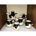 SECTION 21. A six-piece Paul Cardew design, novelty 'Friesian Cow' tea set, comprising two
