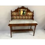 A mahogany marble topped Edwardian washstand with tiled and mirrored splash back, two drawers to the