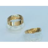 A 9ct yellow gold patterned wedding ring, weighs 3.8 grams, finger size T. Together with a 9ct