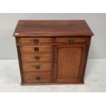 A small Victorian mahogany chest of drawers/cabinet comprising of six drawers and cupboard with