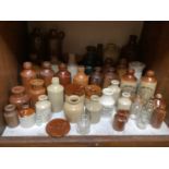 SECTION 8. A large collection of vintage stoneware bottles and jars including brand names R