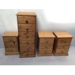 A narrow pine chest of six drawers with round pulls, raised on pedestal base, 114cm tall, together