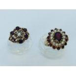 A 9ct gold garnet and seed pearl cluster dress ring, set with an oval garnet to the centre with 14 x