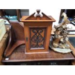 A mahogany miniature table-top cabinet with shaped metal overlaid fretwork door, together with a