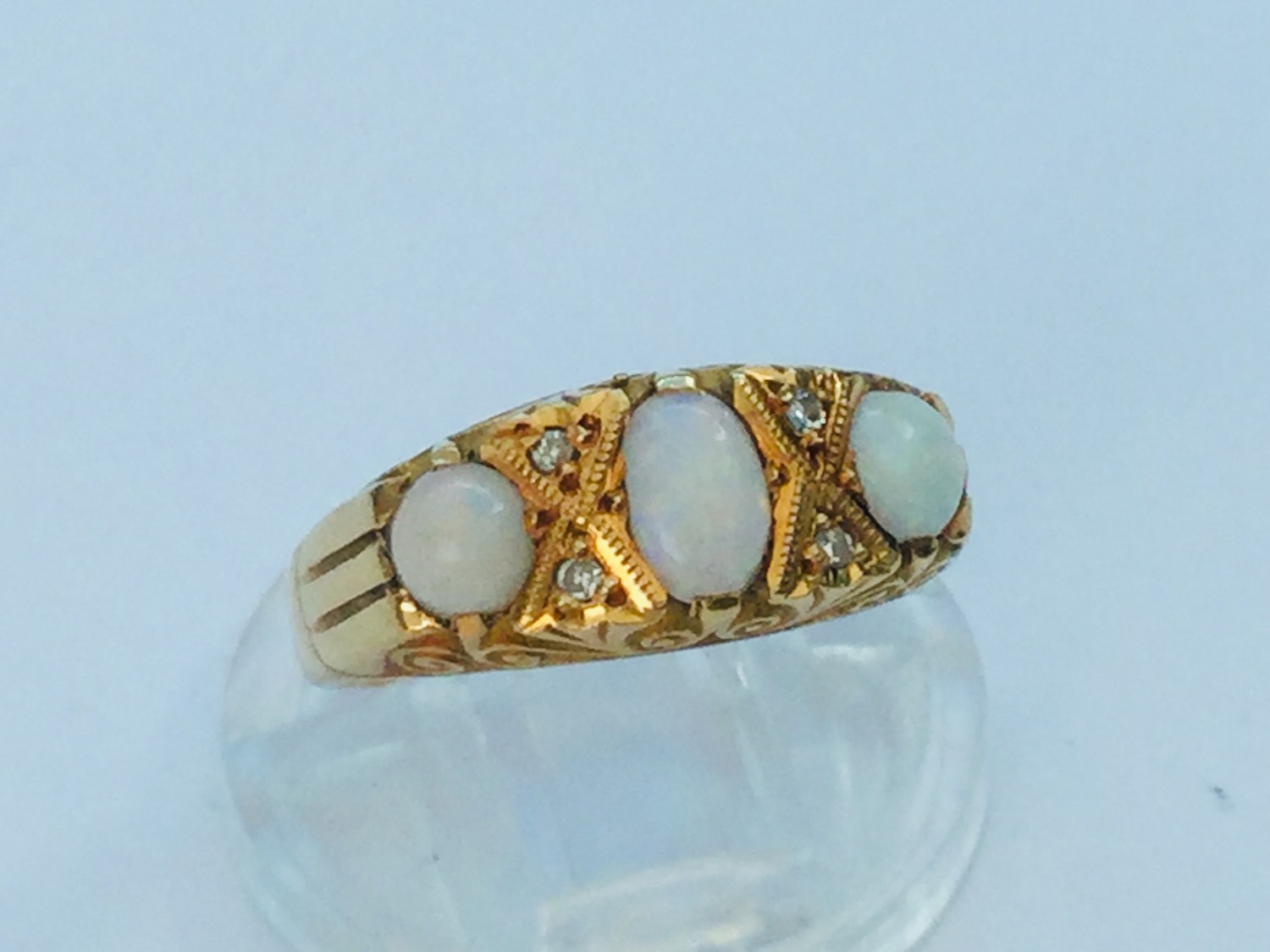 An 18ct yellow gold opal and diamond ring, set with 3 x oval opals and 4 x small diamonds in a gypsy - Image 2 of 2