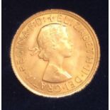 An ERII Gold Sovereign 1964, obv. Mary Gillick portrait, Rev. Pistrucci's George & Dragon, in