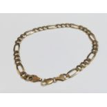 A 9ct yellow gold Figaro link bracelet, weighing 6.8 grams, measuring 8 inches in length.