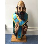 A 20th century French carved and painted oak ships figurehead of Saint Spyridon, reputedly recovered