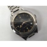 A gents stainless steel Omega Seamaster 300 automatic diving watch, the black dial with 'dart'