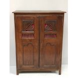 A 18th century and later French walnut cupboard with open spindled sunburst doors, 134 x 100cm