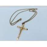 A 9ct yellow gold crucifix and chain, measuring 24 inches, weighing 8.7 grams.
