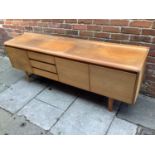 A White & Newton Ltd teak sideboard with three cupboard doors enclosing storage space and a bank