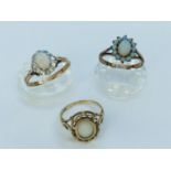 Three 9ct yellow gold opal dress rings, total weight 7.5 grams.