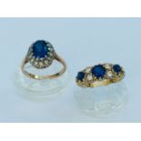 Two 9ct yellow gold dress rings both set with blue and white stones, total weight 7.2 grams.