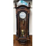 A large 19th century burr walnut and ebonised vienna wall clock, with domed top, white enamel and