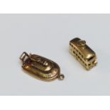 Two 9ct yellow gold novelty transport charms, one of a double decker bus, the other a hovercraft,