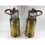 A pair of brass and copper submarine safety lamps, marked 'McGeoch 0583 900-4090, 25cm high not