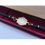 A 9ct gold wristwatch J.W. Benson, rectangular case, subsidiary seconds dial, in J.W. Benson box.