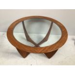 A mid-20th century G-Plan 'Astro' circular glass topped teak coffee table designed by Victor