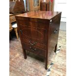 A George III inlaid mahogany washstand with metal carry handles either side, the top opening to