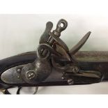 A late 18th/ early 19th century flintlock carbine, with 23" inch steel barrel, lock engraved with