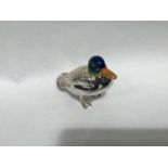 A silver and enamel figure of a duck, probably by Saturno, with enamelled head and silver body,