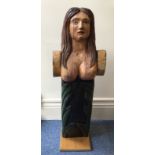 A 19th century wooden carved and painted ship's figure head, modelled as a topless maiden, on wooden
