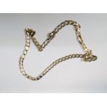 A 9ct yellow gold curb link chain, measuring 22 inches in length, weighs 35.0 grams.