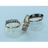 Three 9ct gold dress rings set with various coloured stones, total weight 7.7 grams