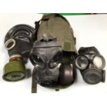 A British Army S10 gas mask in haversack with instructions, together with Soviet GP-5 gas mask and