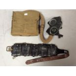 A British Mark VII R.M.A. 1943 dated gas mask, with canvas bag and eye-shields, together with a