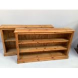 A pair of antique style pine bookcases one with two shelves the other with one, 182cm wide, 92cm