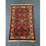Three hand made Caucasian rugs/runners the largest is in a geometric design with medallion style and