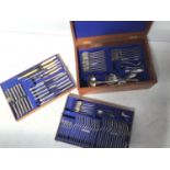 A large canteen of silver-plated flatware comprising knives, forks, spoons and servers etc.