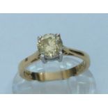 An 18ct yellow gold solitaire diamond ring, the round brilliant cut diamond is set in a four claw
